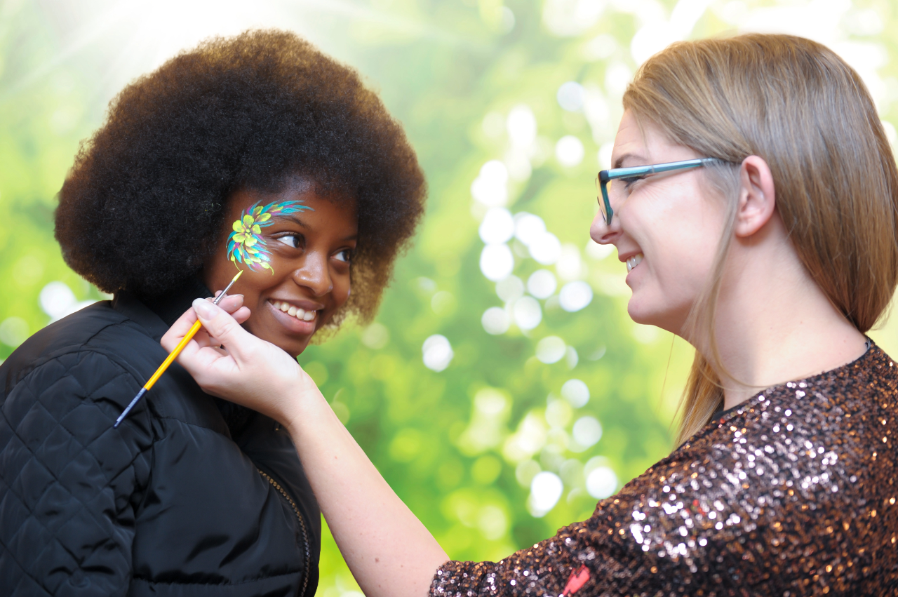 Student has her face painted at a Together at Warwick celebration event.
