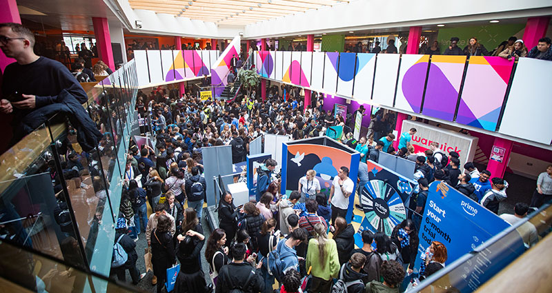 The SU Welcome fair in full swing, crowds of people fill the room 