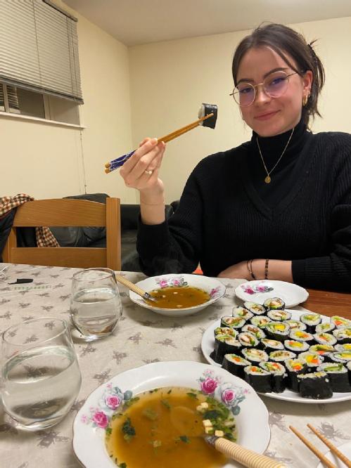 Student eating sushi