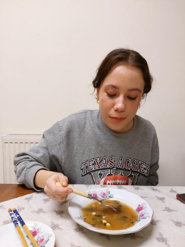 Student eating soup