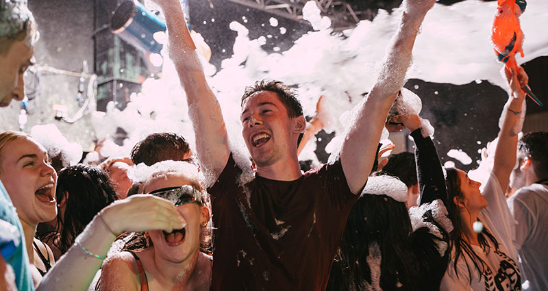 A group of students at a foam party