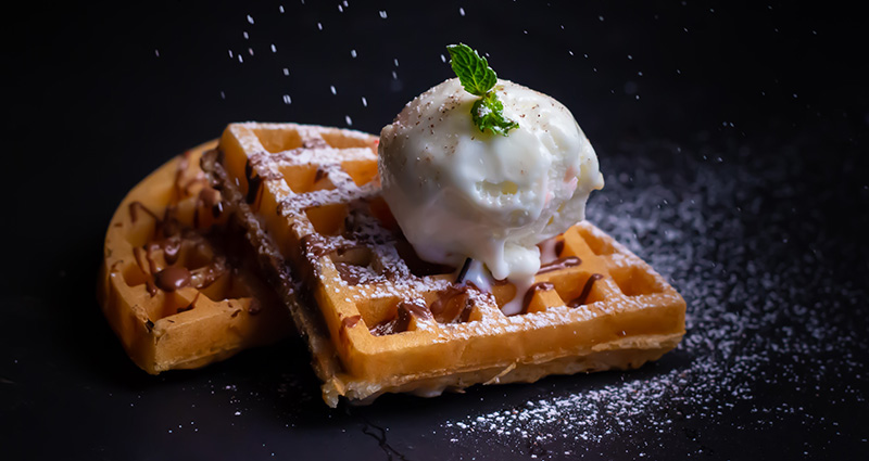 A toasty warm waffle, topped with a healthy dollop of melting vanilla ice-cream. 