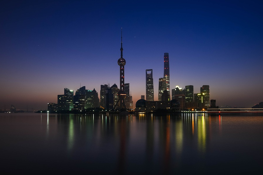 Shanghai's landmark port-side city scape lit by twilights on the back