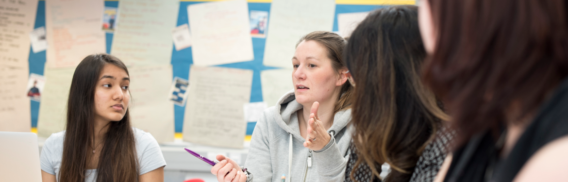 a few female students in a classroom setting