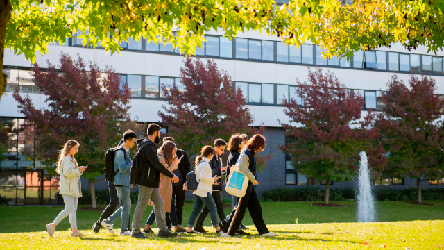 This image shows a group of students on the University of Warwick campus