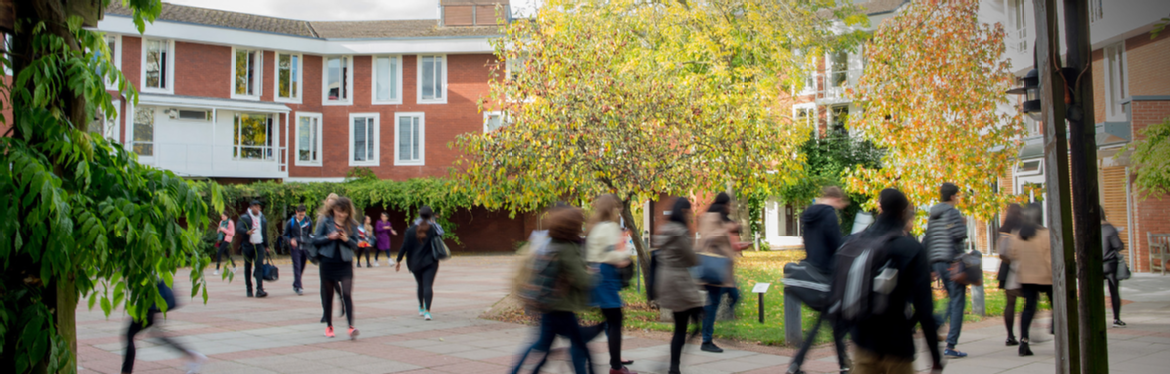 Students walking outside the Social Sciences building at the University of Warwick.