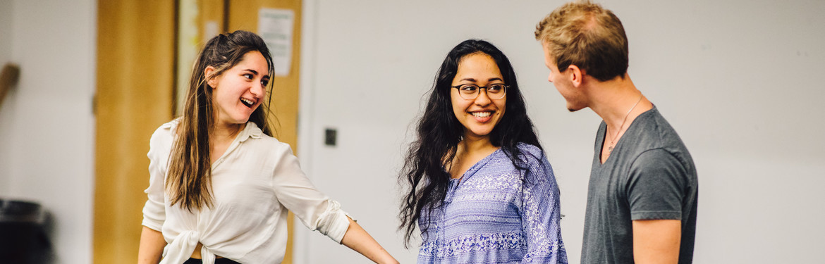 This image shows a diverse group of theatre students