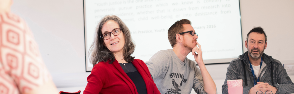 A group of CLL students in different age and gender in a classroom setting