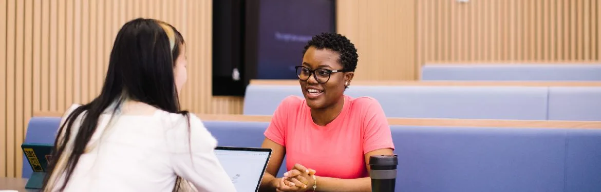 Business with Consulting students talking