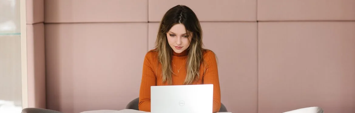 A student working on a laptop.