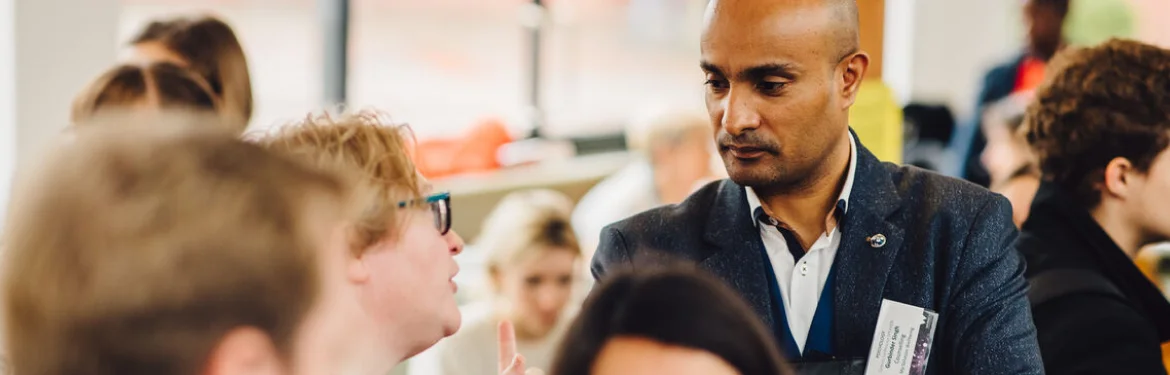 Students having a friendly discussion at an event