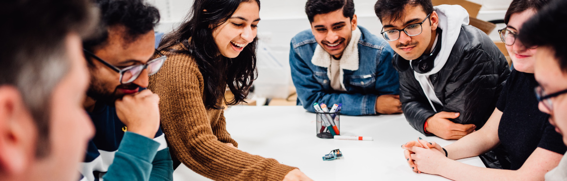 a group of postgraduate engineering students in conversation