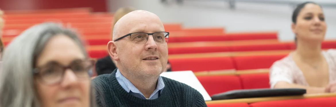 Student attending a lecture in Adult Education and Lifelong Learning