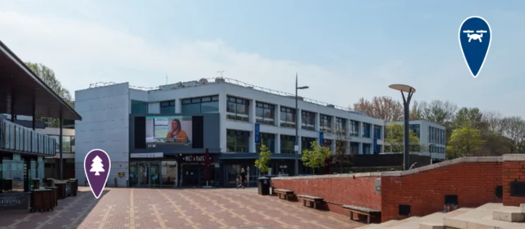 A campus buildings showing an icon available in the virtual tour.