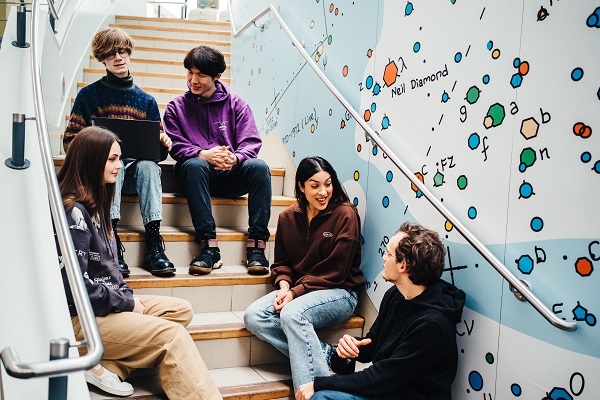 Students talking on stairs at Warwick