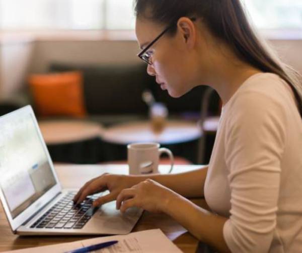 Student looking at laptop