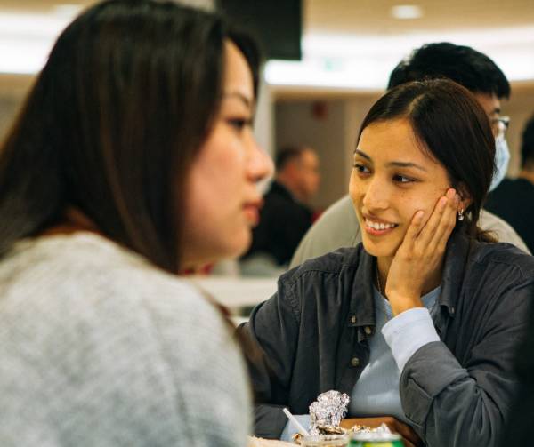 Pre-sessional English student sitting at table