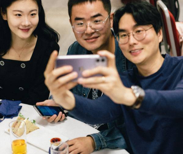 Three pre-sessional students taking a selfie