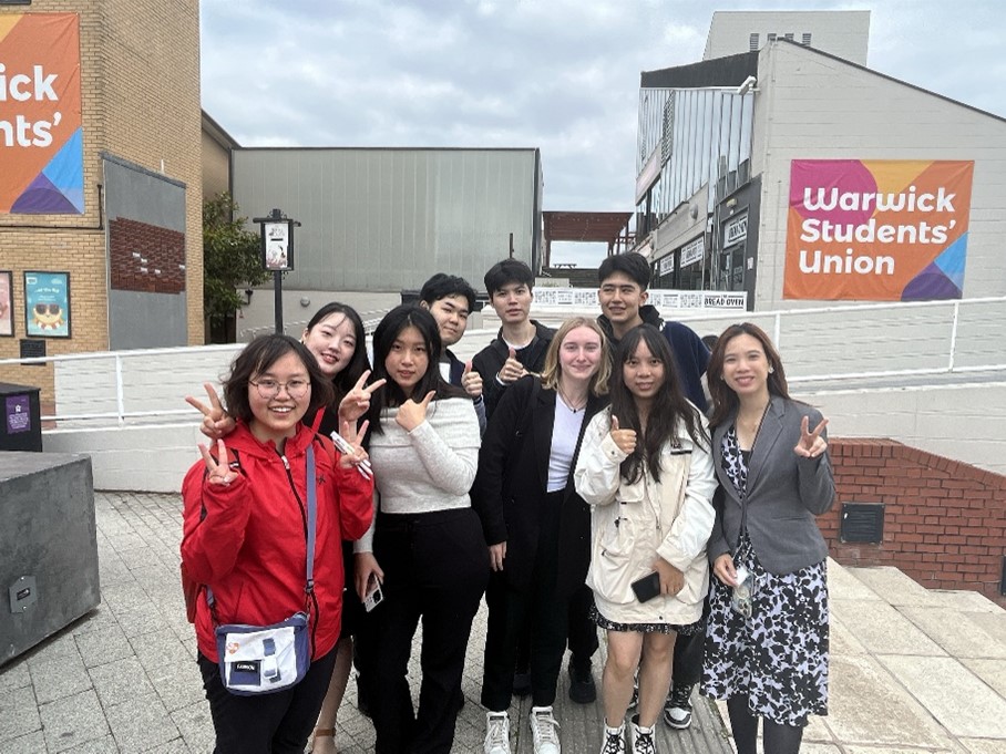 Group of students posing on the Warwick Piazza 