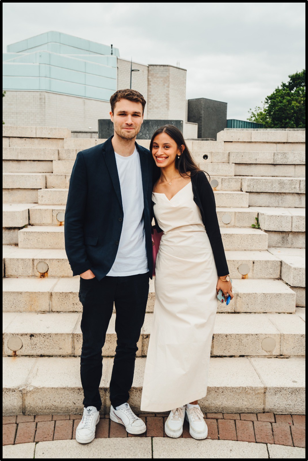 Two students on the steps of the Warwick Piazza