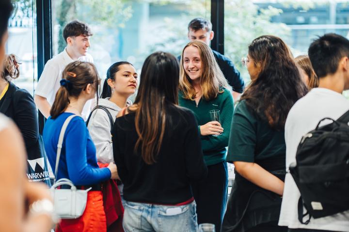 Students talking in a small group at a Summer School event
