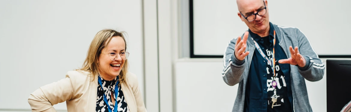 Social work lecturers in discussion with class