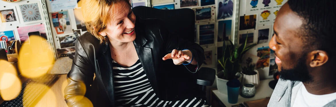 A student and member of staff from Psychology having a conversation