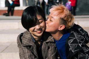 two_students_kissing_on_cheek.jpg
