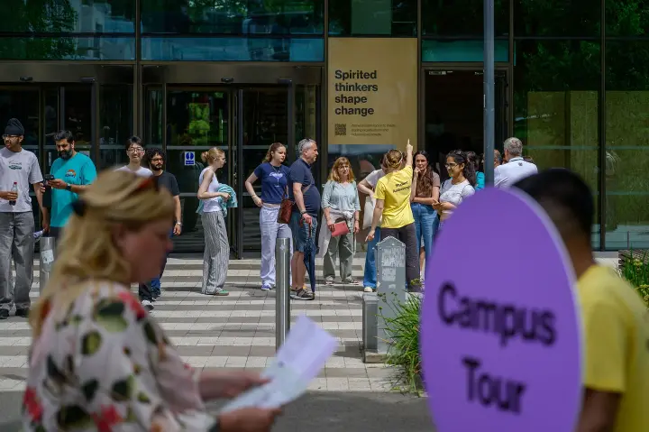parents and prospective students being given a tour of the Warwick campus.
