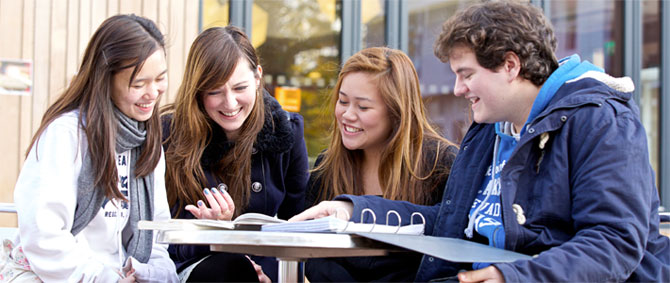 students gathered around a table