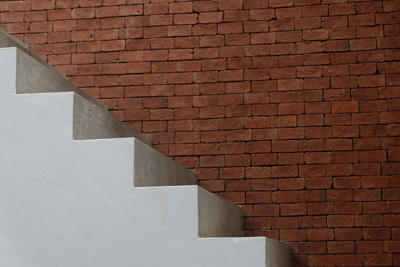 stairs against a brick wall