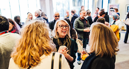 People chatting over drinks