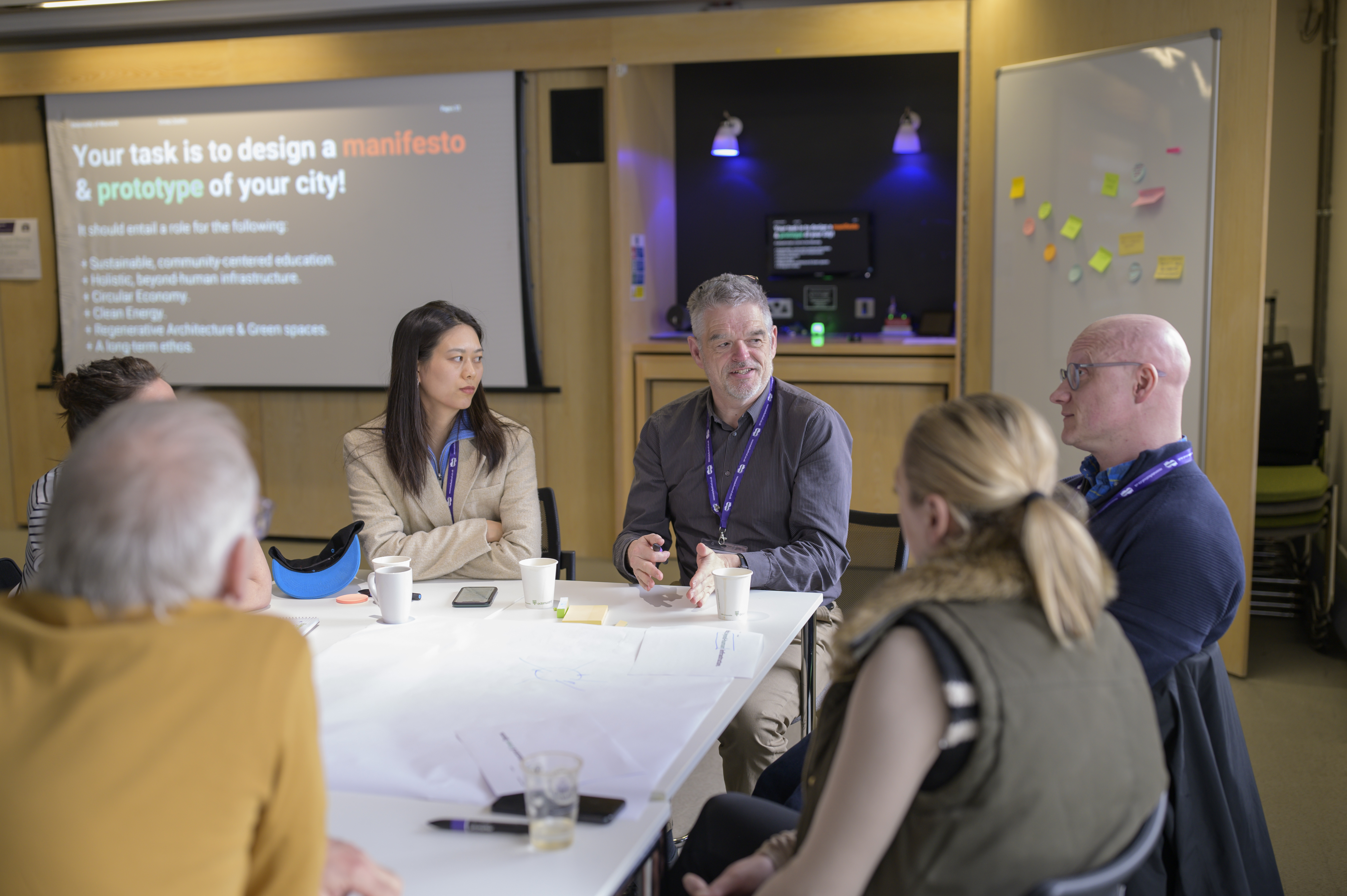People conversing around a table