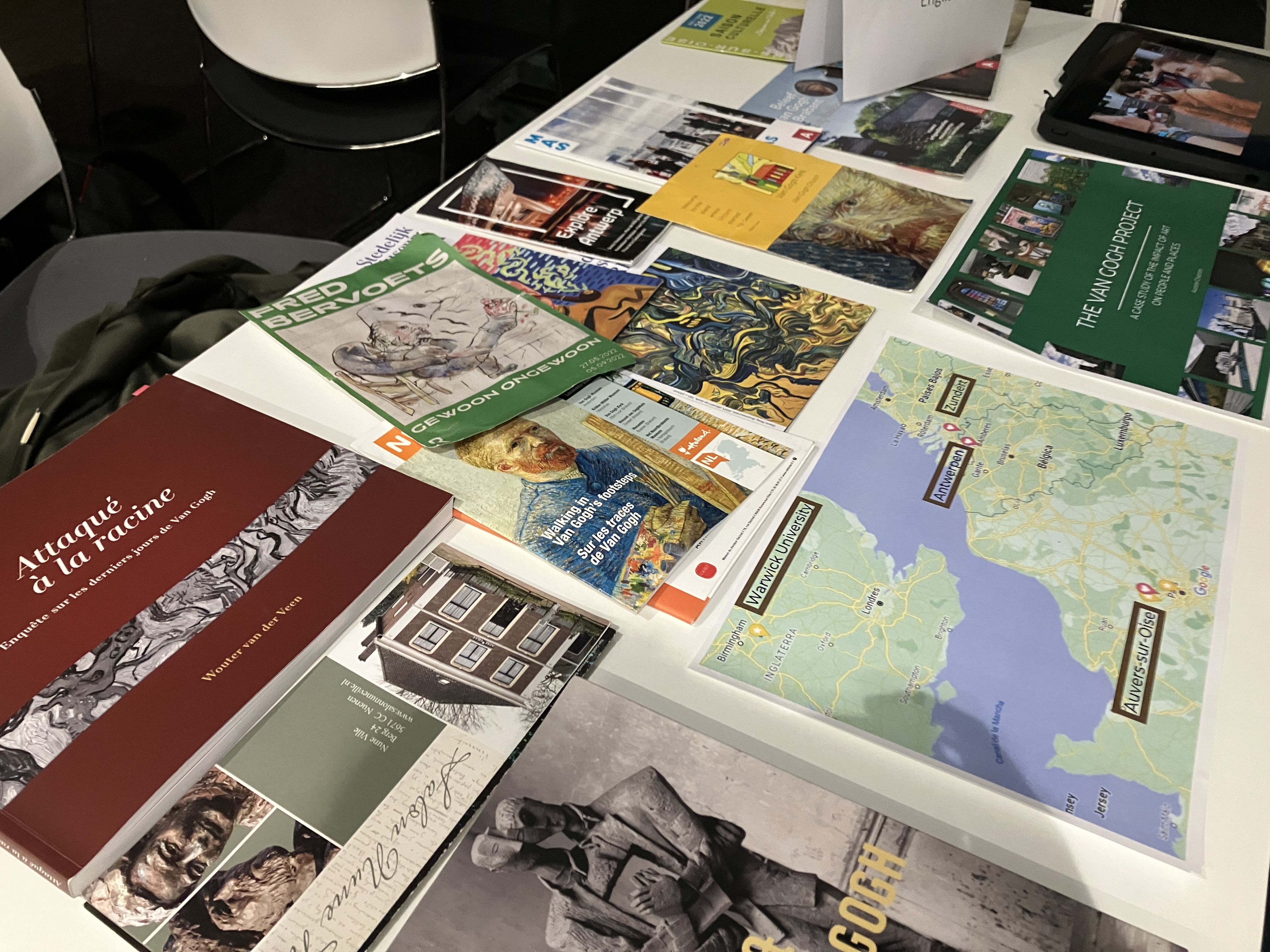 A map and colourful leaflets on a table.