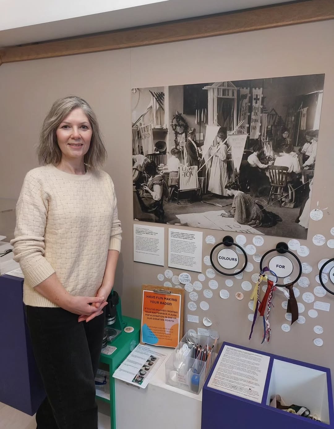 Tara Morton standing next to display of her project.