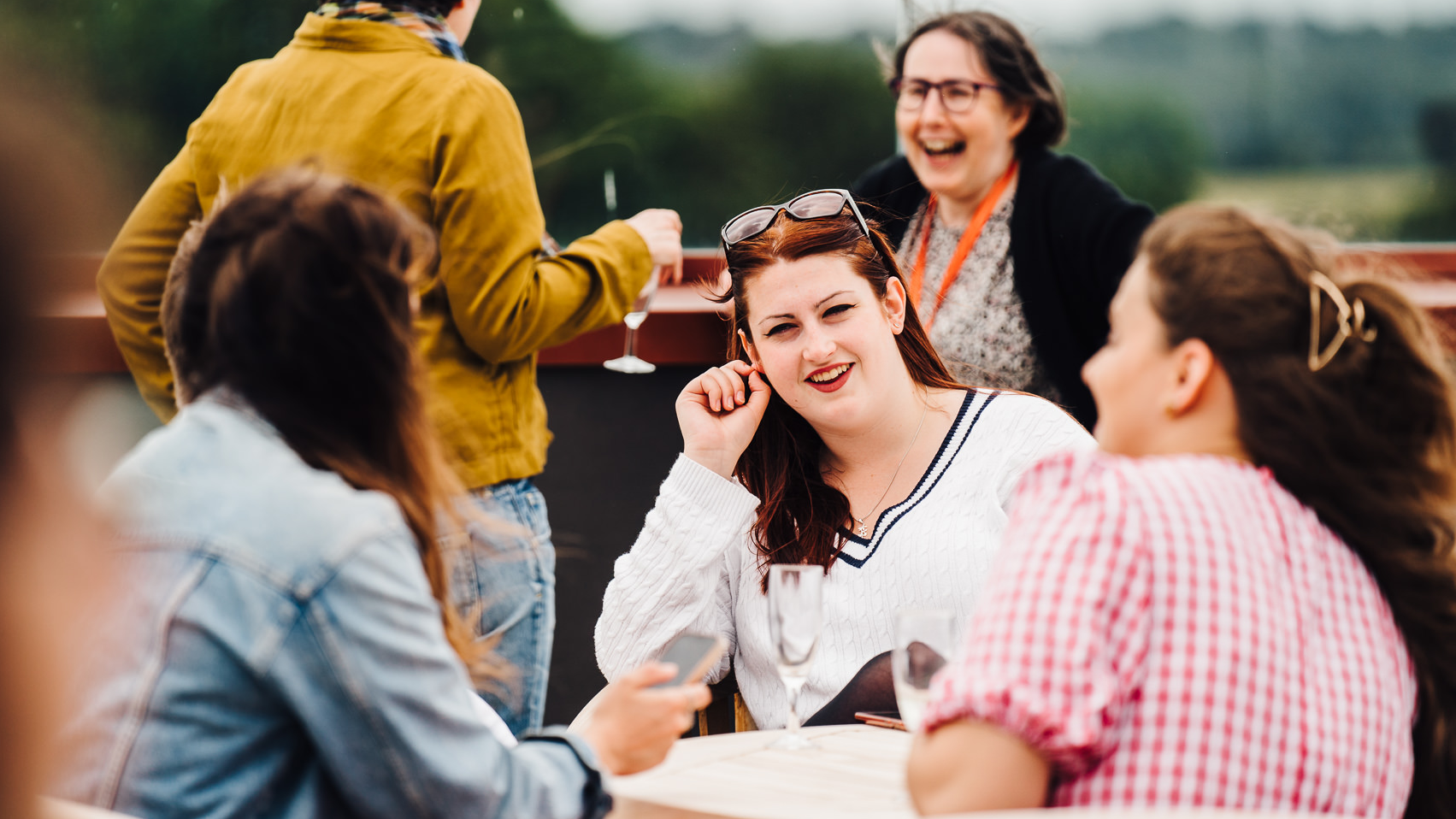 People conversing around an engagement event